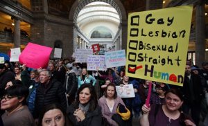 Supporters of gay marriage fill the rotunda as they gathered to rally at the Utah State Capitol Friday Jan. 10. 2014, and  deliver a petition with over 58,000 signatures in support of gay marriage to Utah Governor Gary Herbert.  (AP Photo/Steve C. Wilson)
